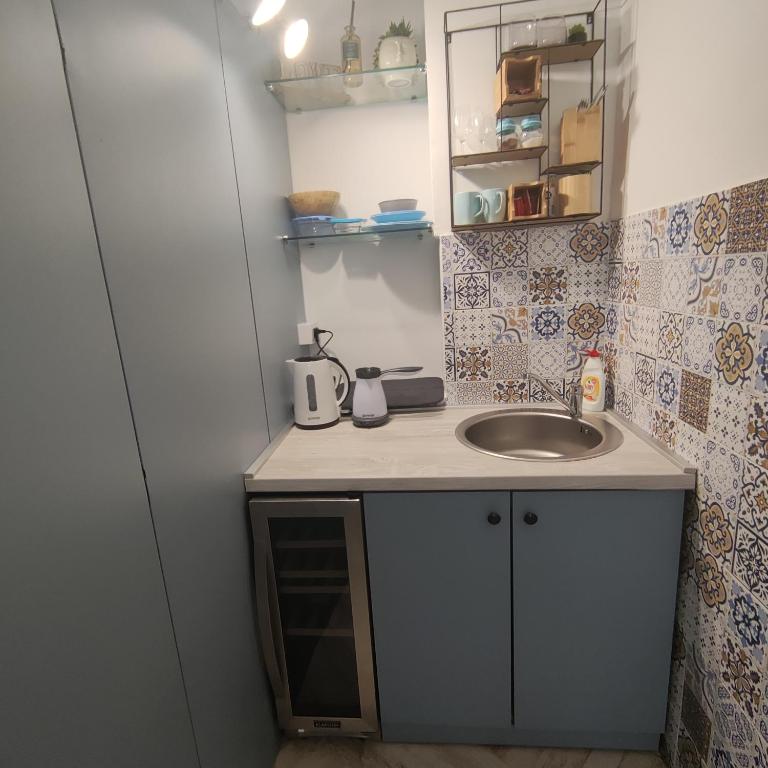 Kuchyň nebo kuchyňský kout v ubytování Room Angel