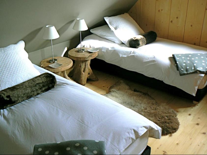 Postel nebo postele na pokoji v ubytování Datchas Lodges