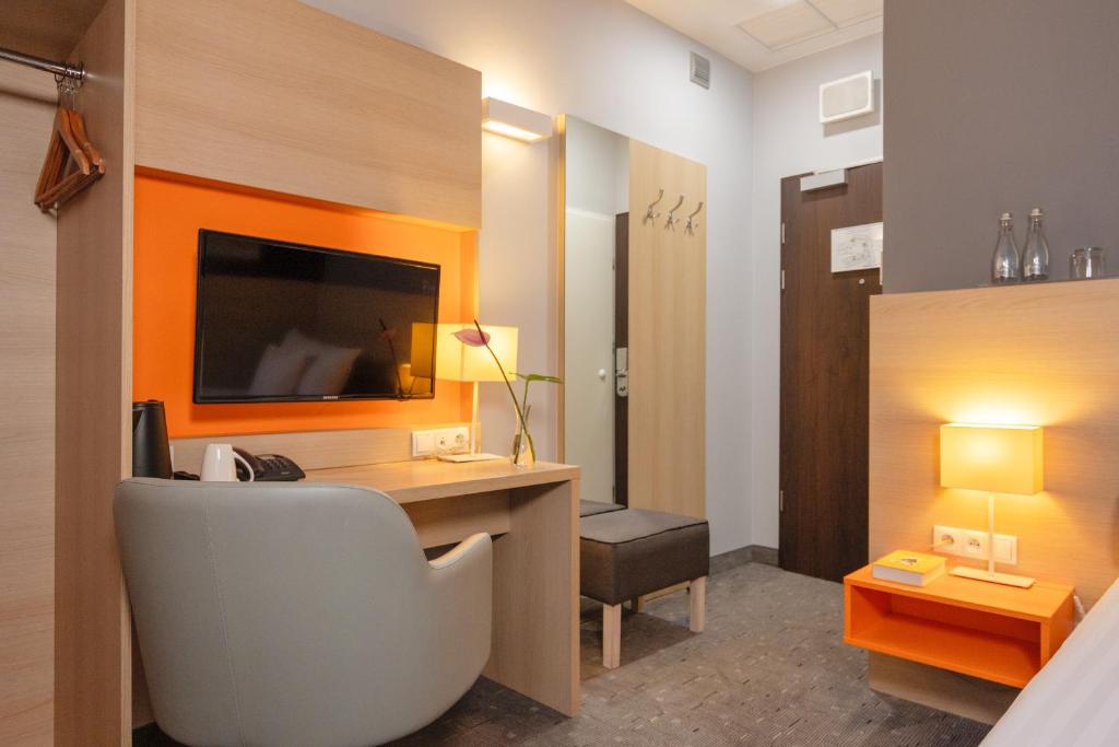 Postel nebo postele na pokoji v ubytování Hotel MDM City Centre