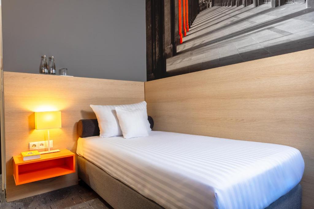 Postel nebo postele na pokoji v ubytování Hotel MDM City Centre
