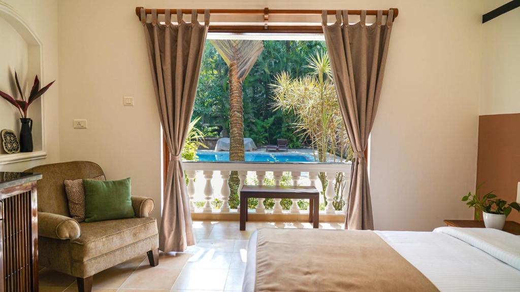 Postel nebo postele na pokoji v ubytování Olive Hotel Alidia Beach Resort by Embassy Group