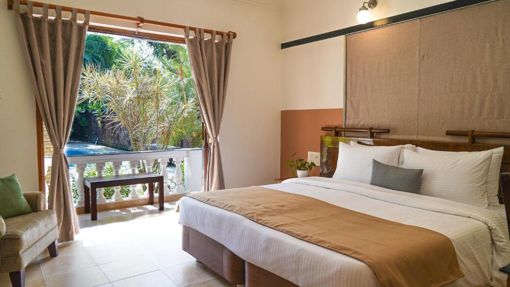 Postel nebo postele na pokoji v ubytování Olive Hotel Alidia Beach Resort by Embassy Group
