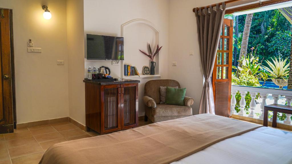 Postel nebo postele na pokoji v ubytování Olive Hotel Alidia Beach Resort by Embassy Group