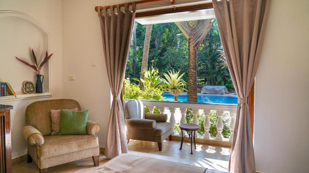 Bazén v ubytování Olive Hotel Alidia Beach Resort by Embassy Group nebo v jeho okolí