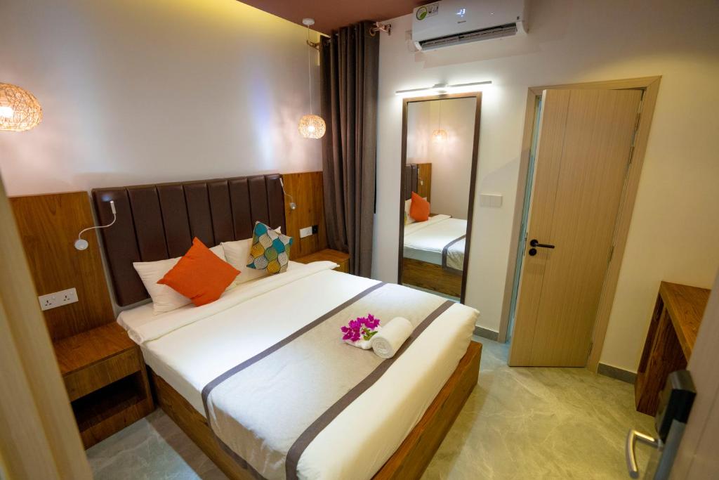 Ένα ή περισσότερα κρεβάτια σε δωμάτιο στο Hikers Villa - Fuvahmulah