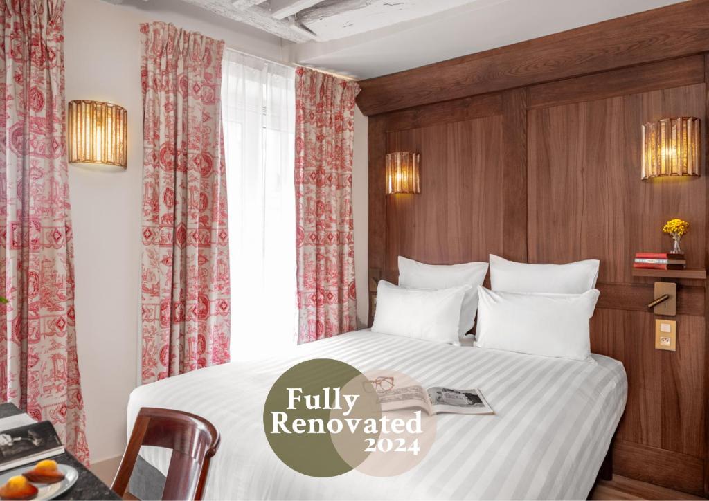 Postel nebo postele na pokoji v ubytování Hotel Madeleine De Senlis