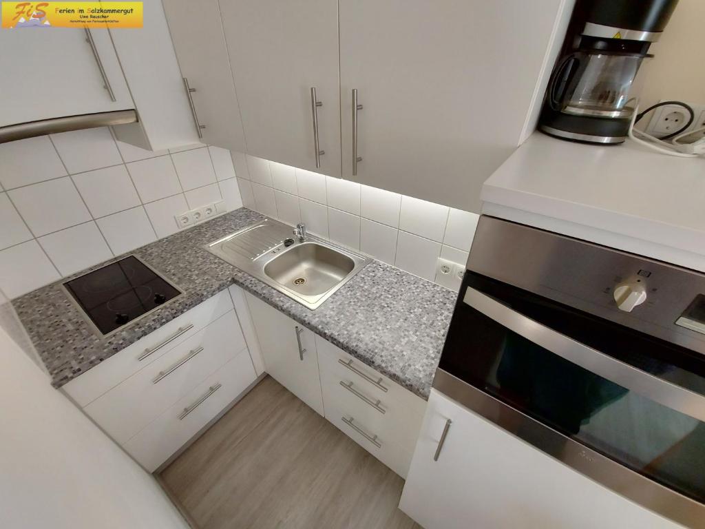 Kuchyň nebo kuchyňský kout v ubytování Apartment Bettina