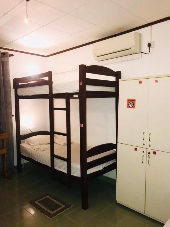 Postel nebo postele na pokoji v ubytování Sky Hostel Negombo