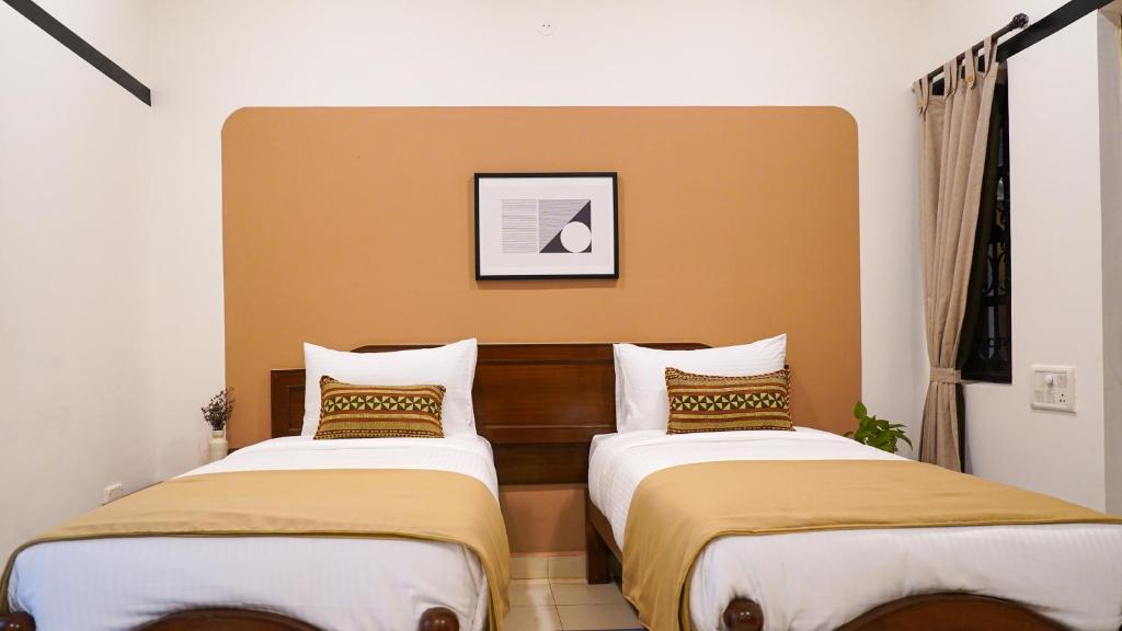 Postel nebo postele na pokoji v ubytování Olive Hotel Alidia Beach Resort by Embassy Group