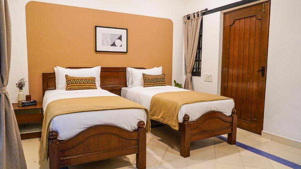 Postel nebo postele na pokoji v ubytování Olive Hotel Alidia Beach Resort by Embassy Group