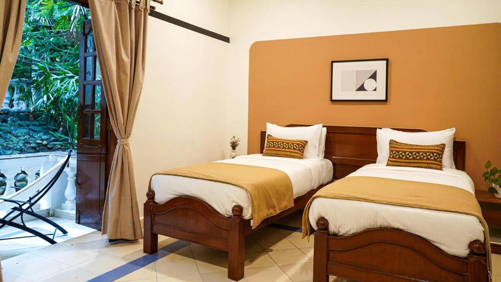 Postel nebo postele na pokoji v ubytování Olive Hotel Alidia Beach Resort by Embassy Group