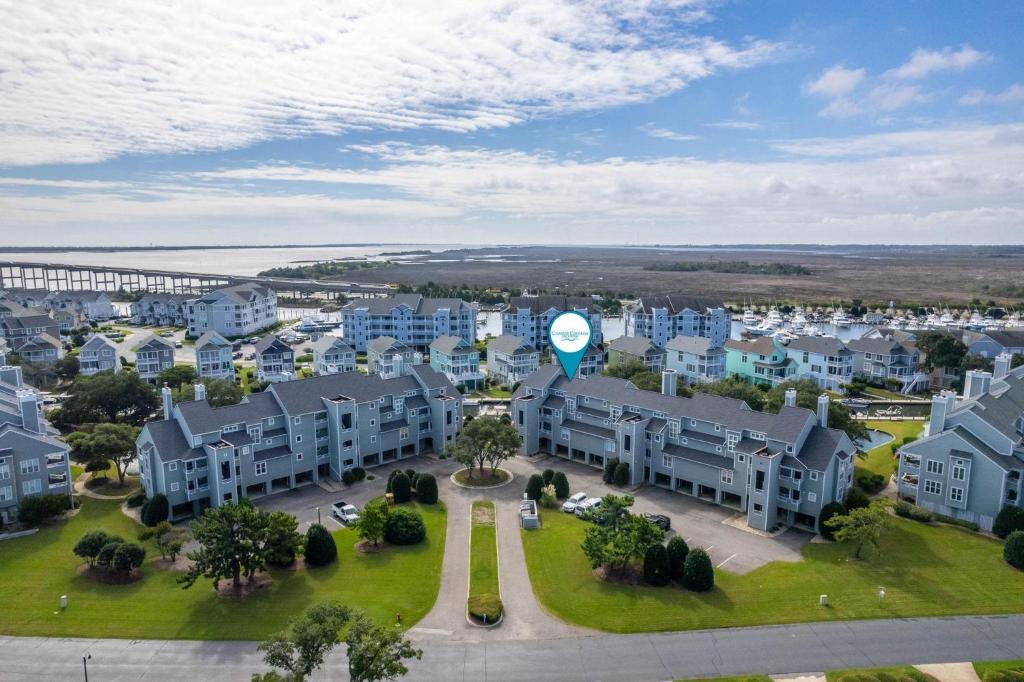 an aerial view of a city with houses and a clock at PCBV325 Anchor's Away in Manteo