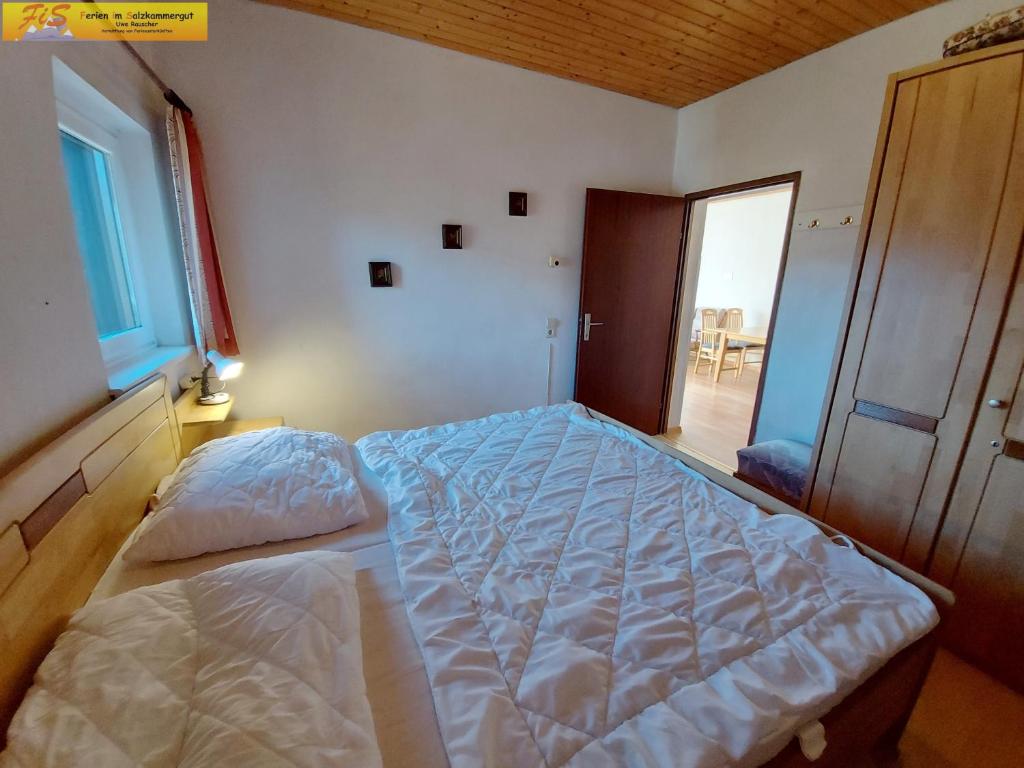 Postel nebo postele na pokoji v ubytování Apartment Grimmingsuite