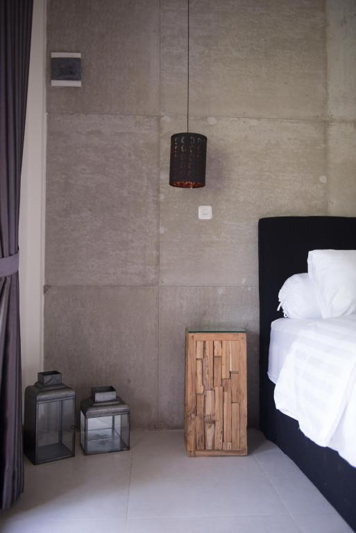 Postel nebo postele na pokoji v ubytování Blue Garden Yogyakarta
