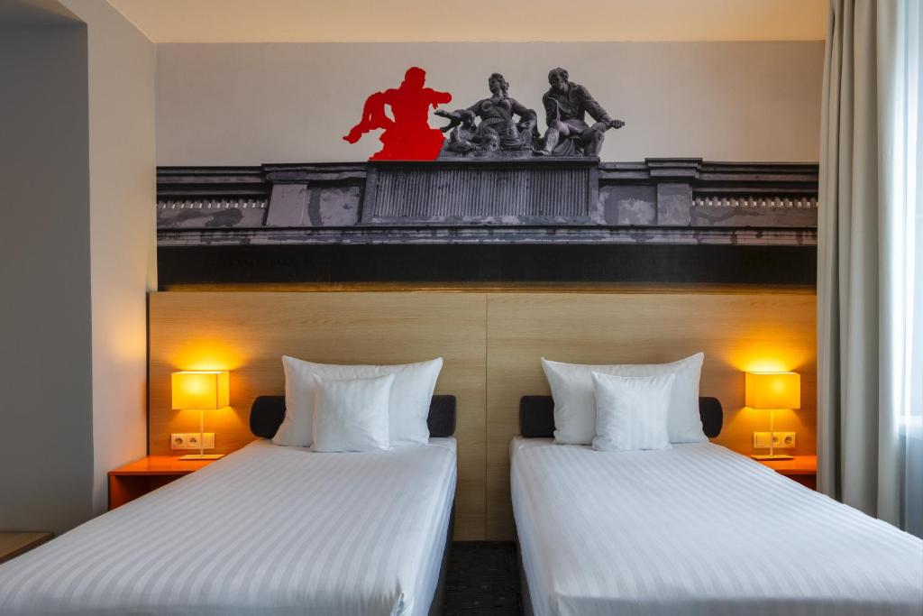 Postel nebo postele na pokoji v ubytování Hotel MDM City Centre