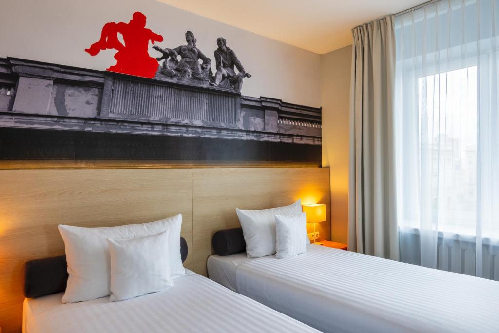 Postel nebo postele na pokoji v ubytování Hotel MDM City Centre