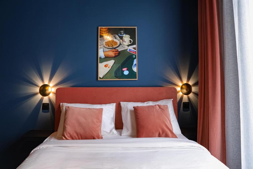 Postel nebo postele na pokoji v ubytování The Mila Hotel