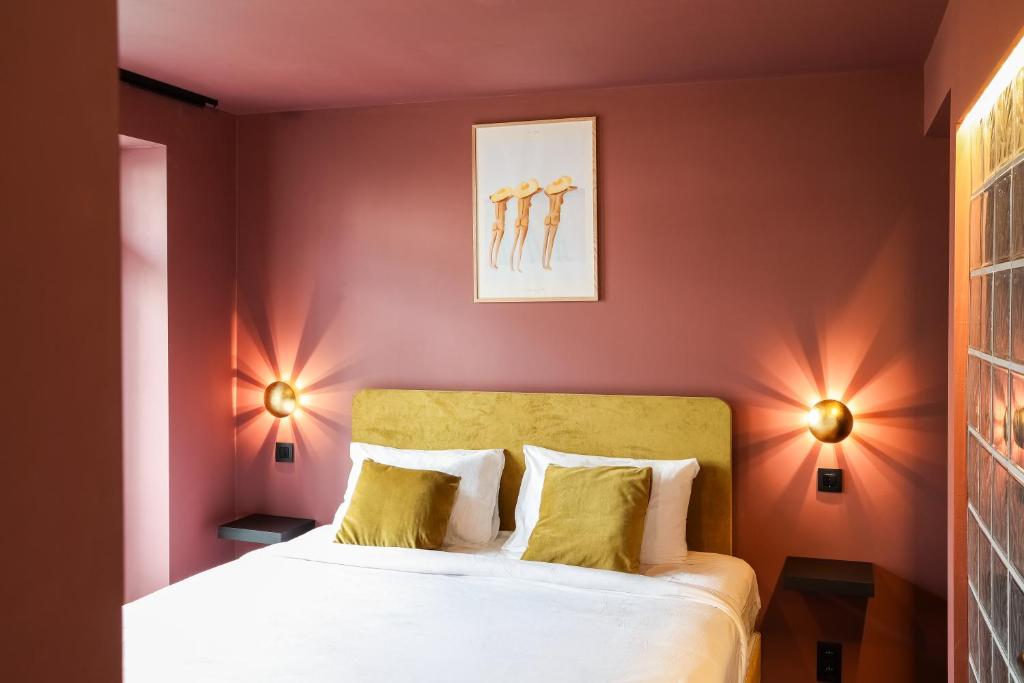 Postel nebo postele na pokoji v ubytování The Mila Hotel