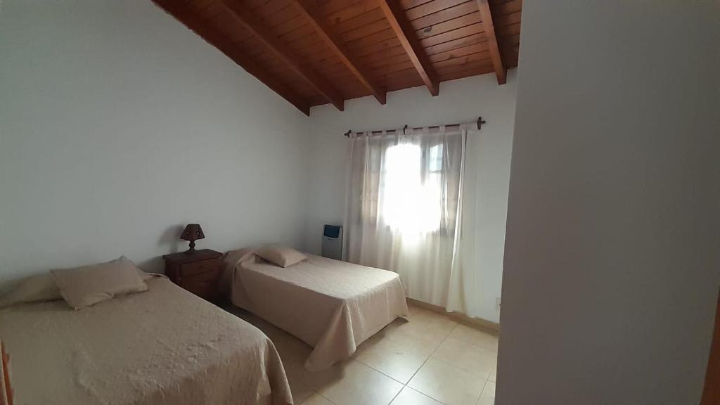 Ένα ή περισσότερα κρεβάτια σε δωμάτιο στο Casa Oro y miel