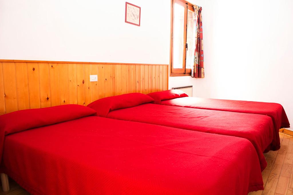 A bed or beds in a room at Apartamentos Grist