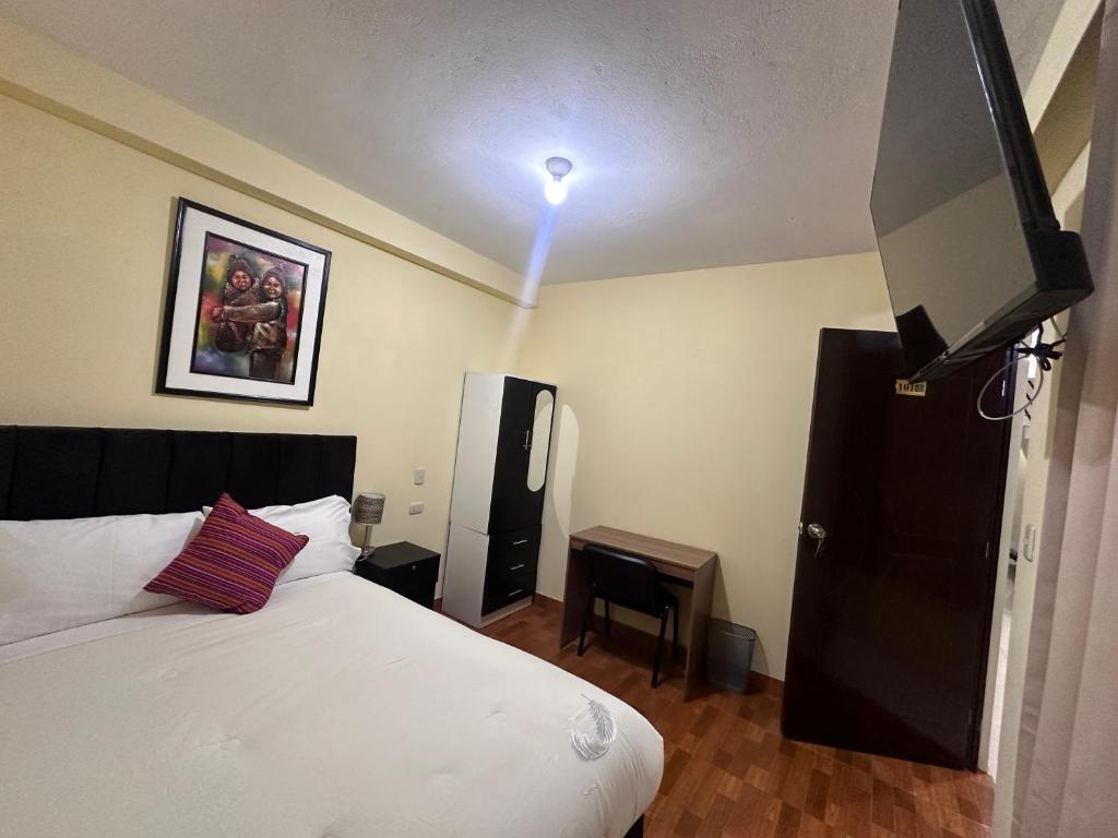 Postel nebo postele na pokoji v ubytování Valicha Casa Hotel