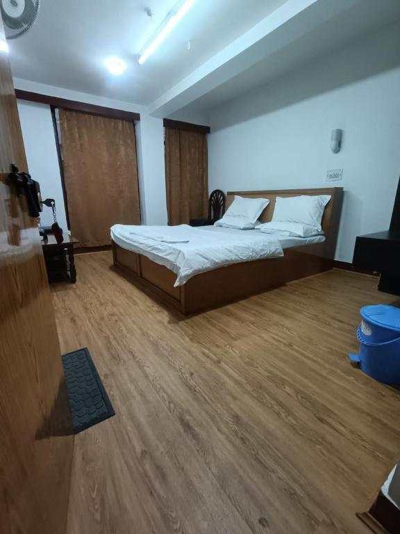 Postel nebo postele na pokoji v ubytování Hotel Ruby and Restaurant