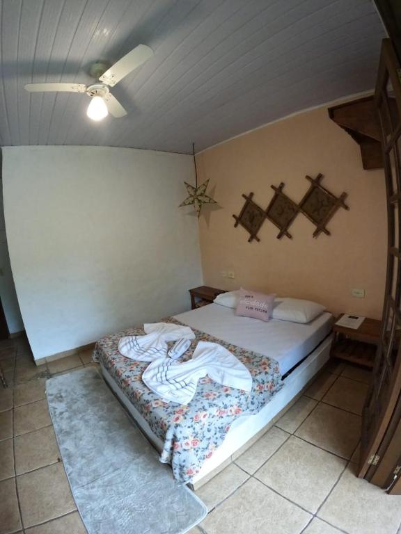 Postel nebo postele na pokoji v ubytování Refúgio do Kairós