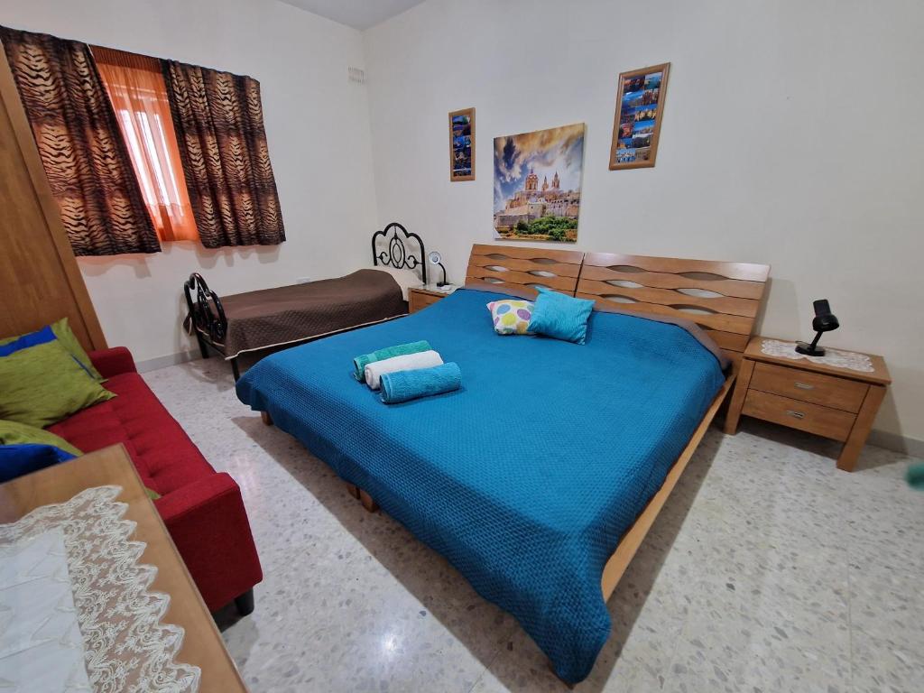 Postel nebo postele na pokoji v ubytování Saracini's Homestay