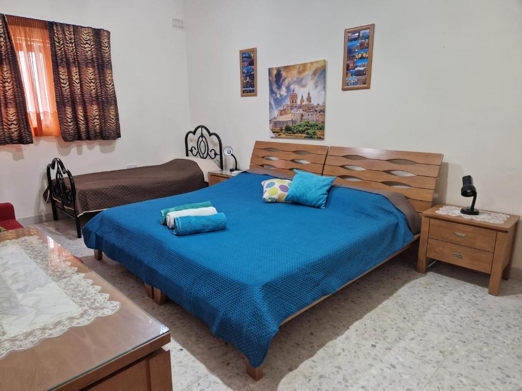 Postel nebo postele na pokoji v ubytování Saracini's Homestay