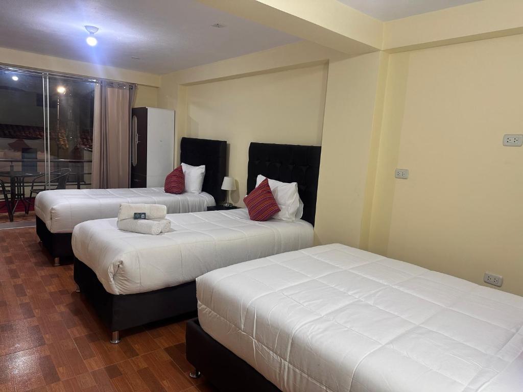 Postel nebo postele na pokoji v ubytování Valicha Casa Hotel