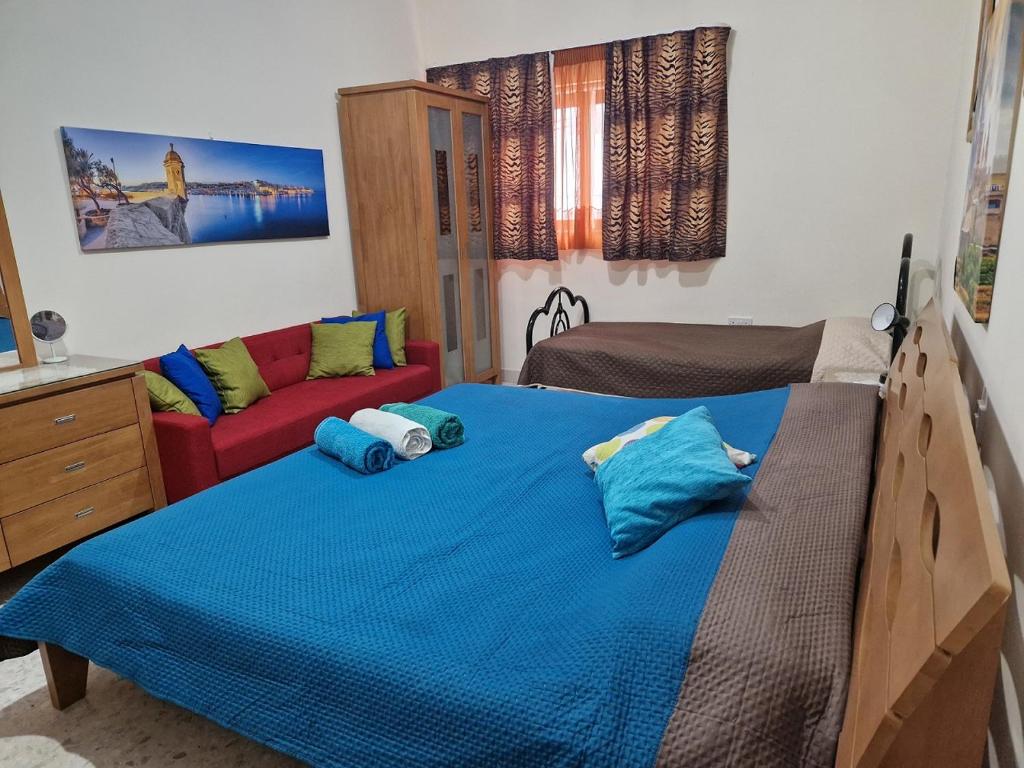 Postel nebo postele na pokoji v ubytování Saracini's Homestay