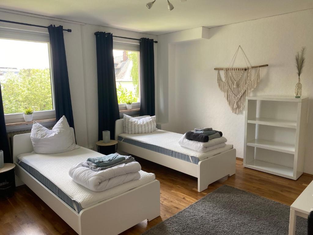 Postel nebo postele na pokoji v ubytování Apartmenthaus Selbitz
