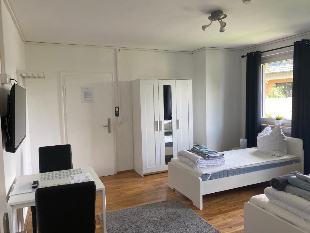 TV a/nebo společenská místnost v ubytování Apartmenthaus Selbitz