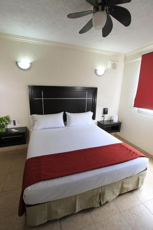 Postel nebo postele na pokoji v ubytování Hotel Estadio
