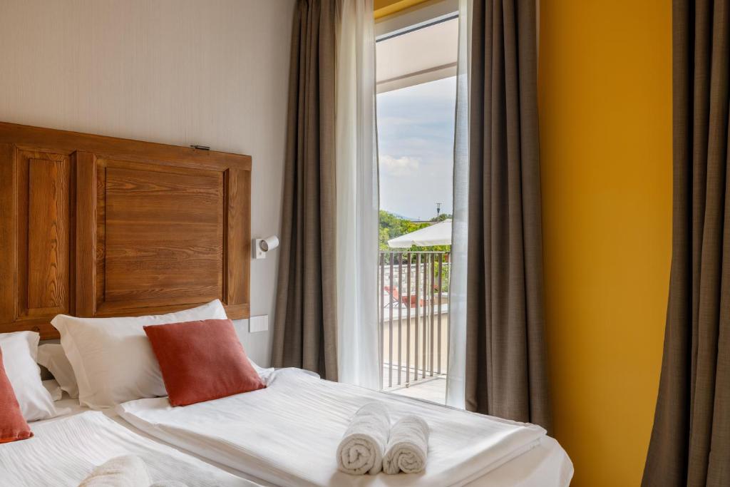 Postel nebo postele na pokoji v ubytování Hotel Elvezia