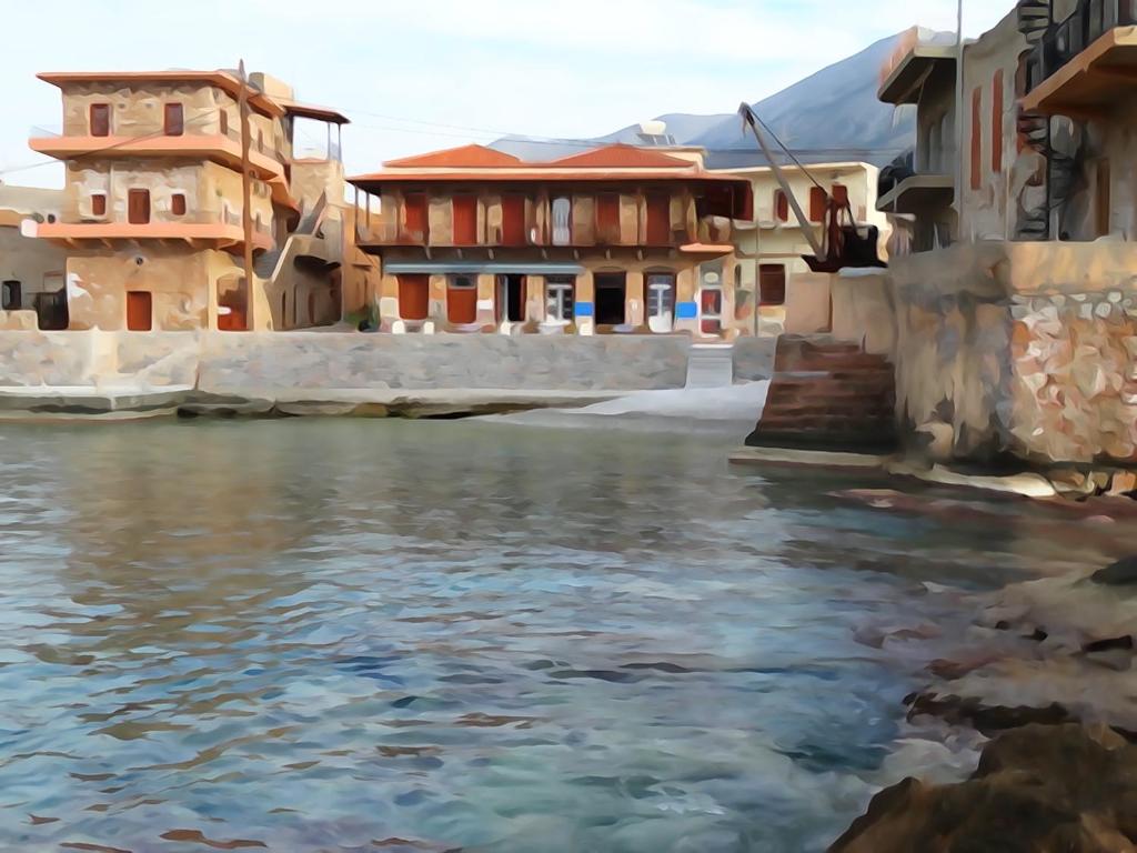 una pintura de un río frente a las casas en Akrotainaritis, en Yerolimin
