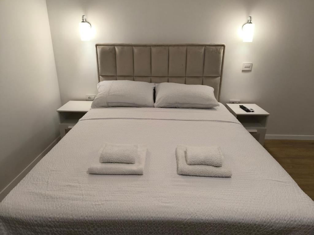 Ένα ή περισσότερα κρεβάτια σε δωμάτιο στο Apartman Ivan