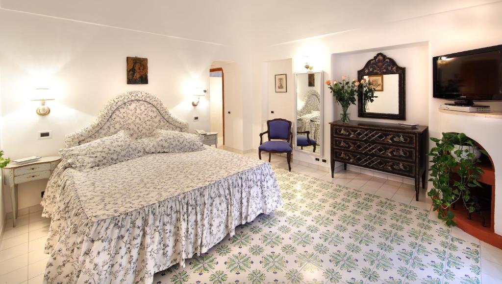 Postel nebo postele na pokoji v ubytování Hotel Villa Brunella
