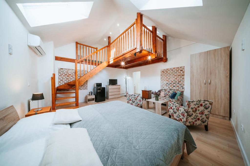 Posteľ alebo postele v izbe v ubytovaní Apartmány Reduta