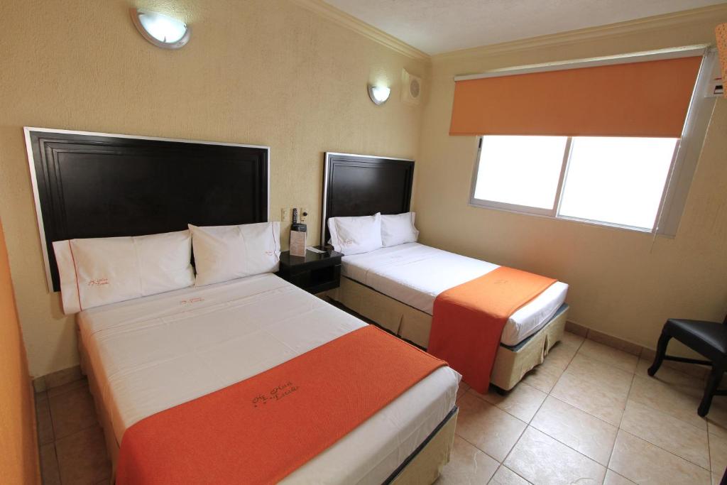 Postel nebo postele na pokoji v ubytování Hotel Estadio