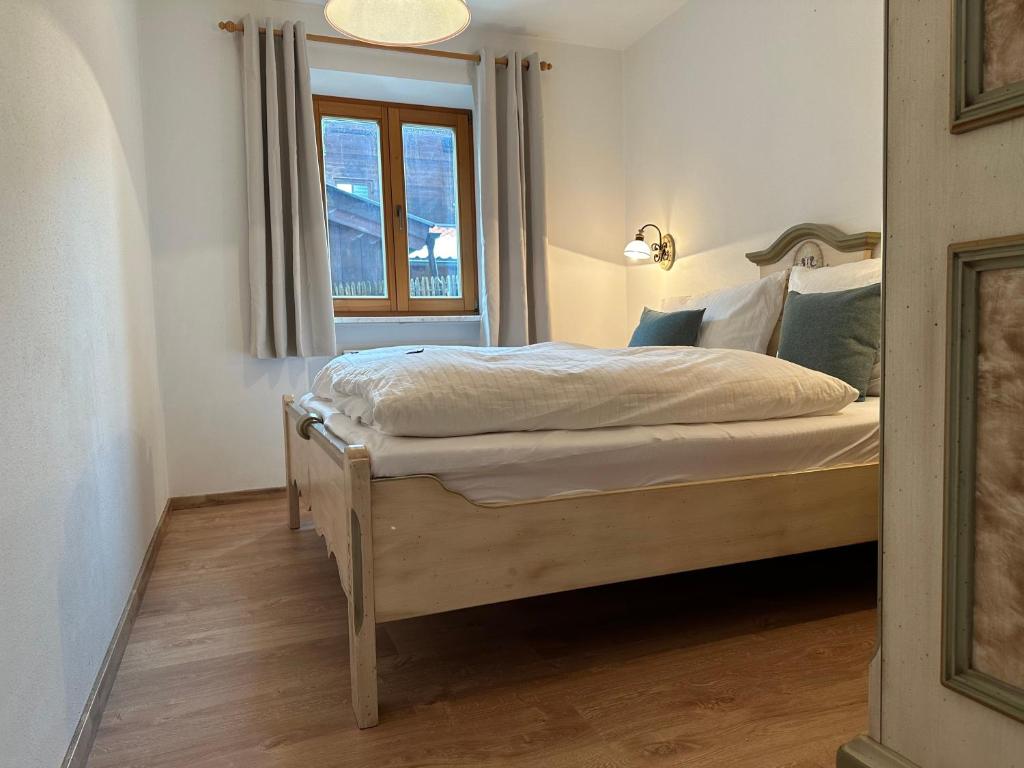 Postel nebo postele na pokoji v ubytování Alpenflair Apartments