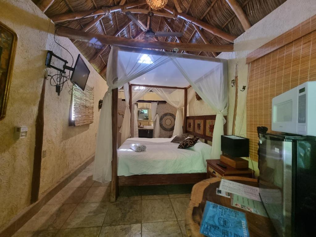 Postel nebo postele na pokoji v ubytování Eco Hotel Tahawi