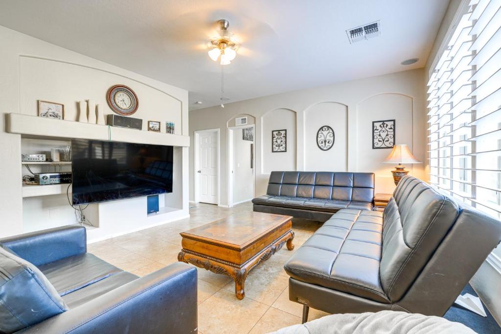 a living room with couches and a flat screen tv at Pool and Patio San Tan Valley Getaway! in Queen Creek