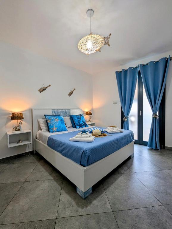 Postel nebo postele na pokoji v ubytování I colori della Sicilia