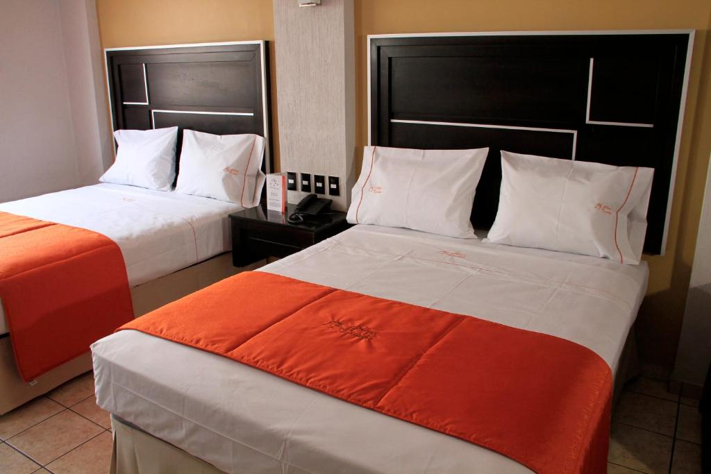 Postel nebo postele na pokoji v ubytování Hotel Estadio