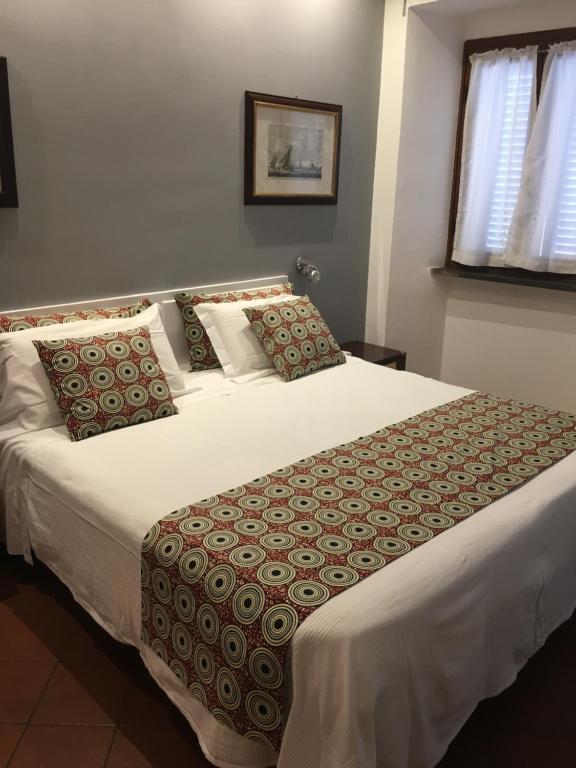 Postel nebo postele na pokoji v ubytování Il Saracino boutique suites