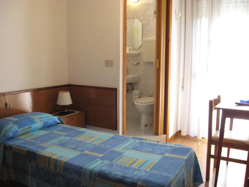 A bed or beds in a room at B&B Garnì Da Vito