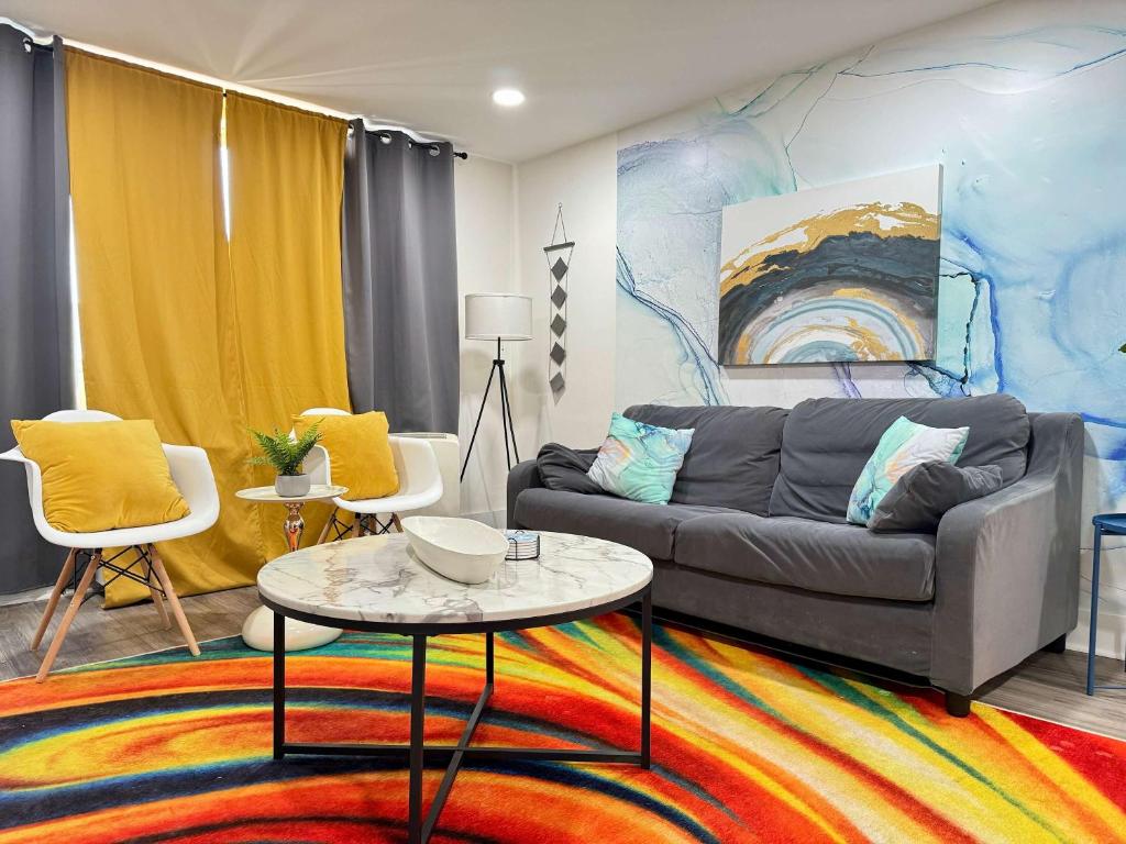 a living room with a couch and a table at 2B1B Modern Downtown ATL Condo w 1 Free Parking LM1007 in Atlanta