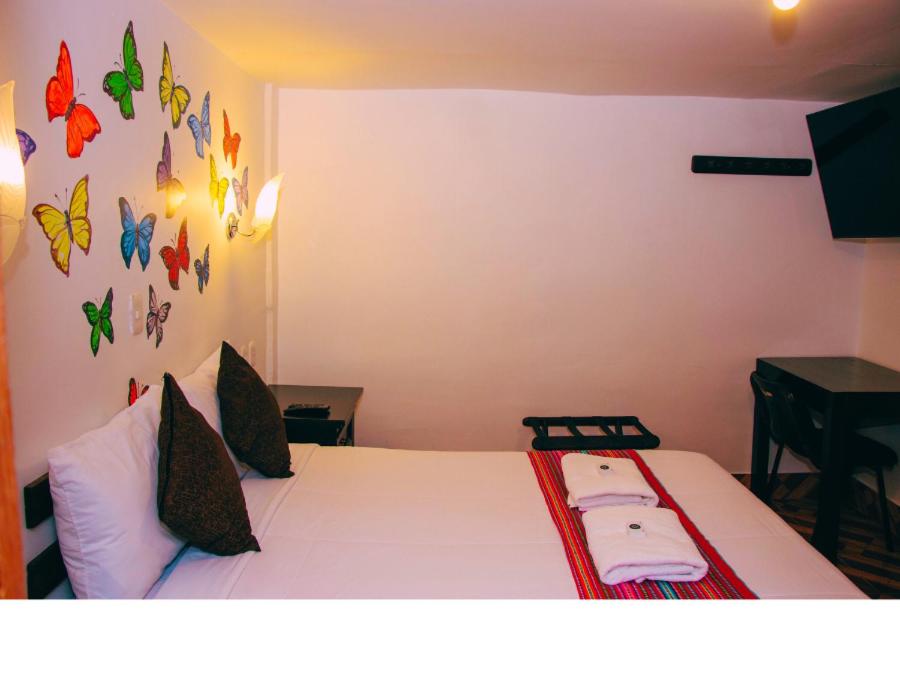 Postel nebo postele na pokoji v ubytování Peru Coca B&B Machupicchu