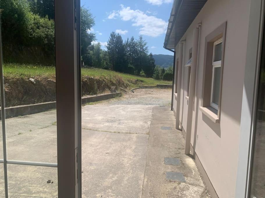 a view from a glass door of a building at Kilbanow house in Lomanagh